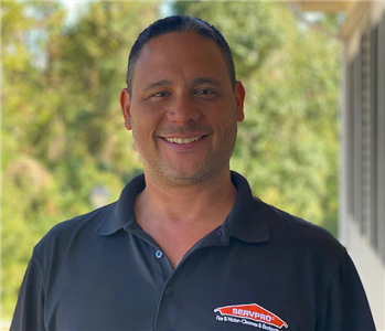 male smiling, wearing SERVPRO shirt 